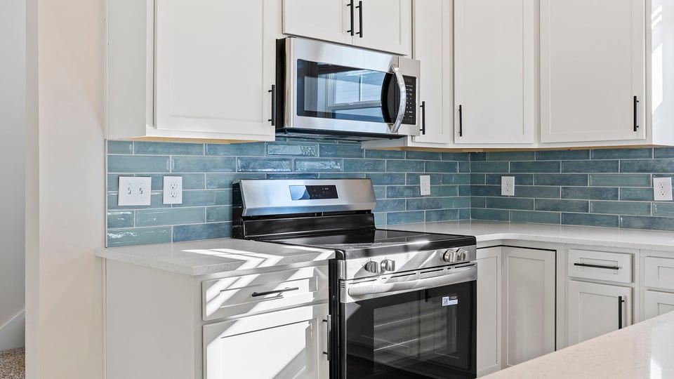 Kitchen with stainless steel appliances and granite countertops.
