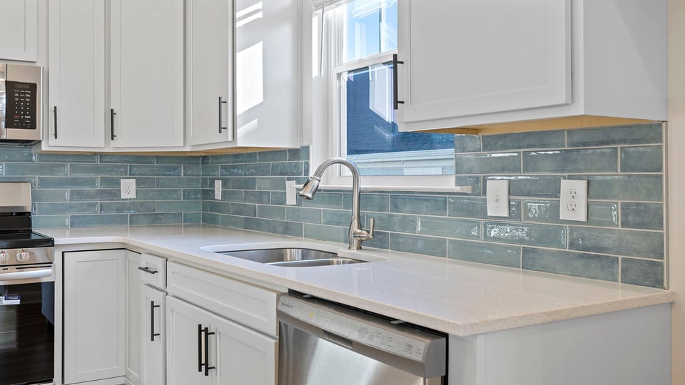 Kitchen with stainless steel appliances and granite countertops.