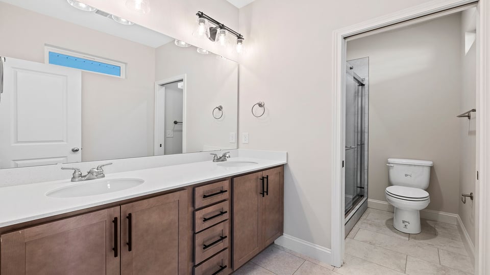 Bathroom with dual vanity.