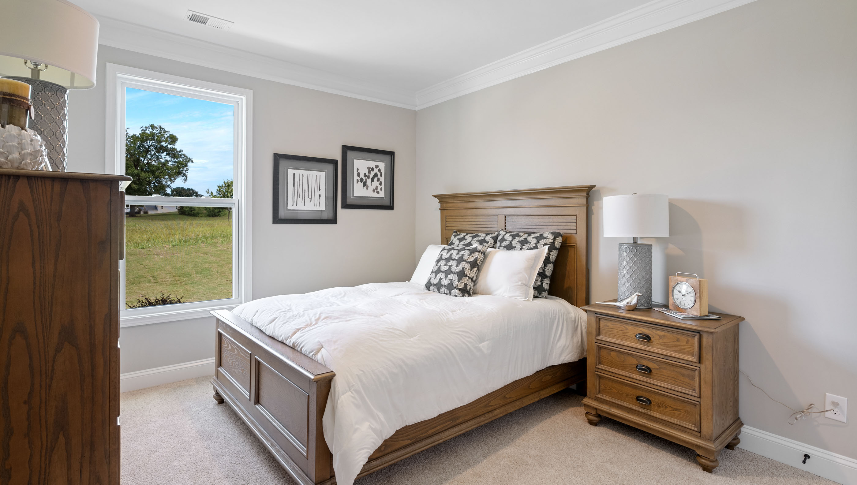 Bedroom with carpet and windows.