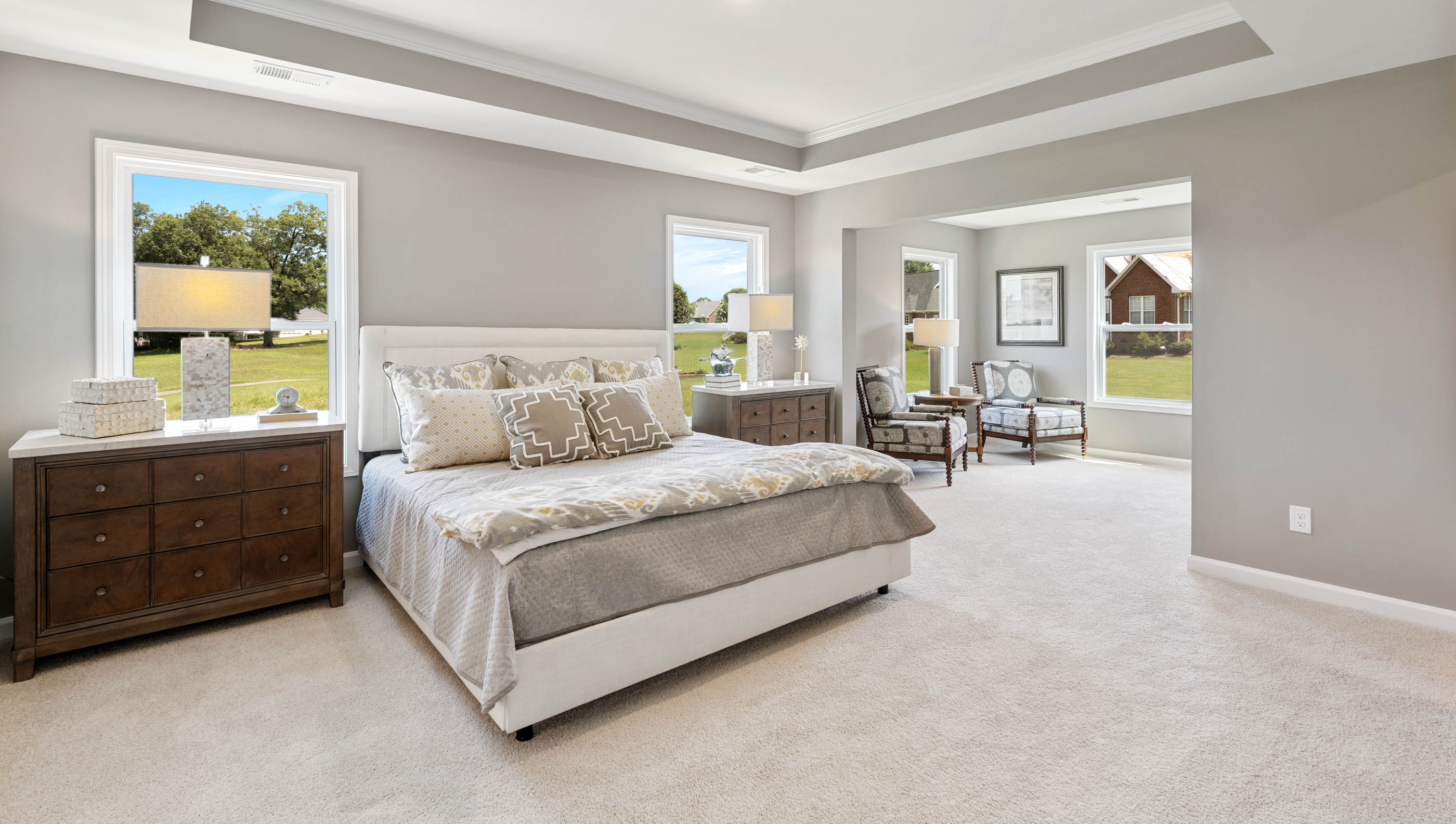 Bedroom with carpet and windows.