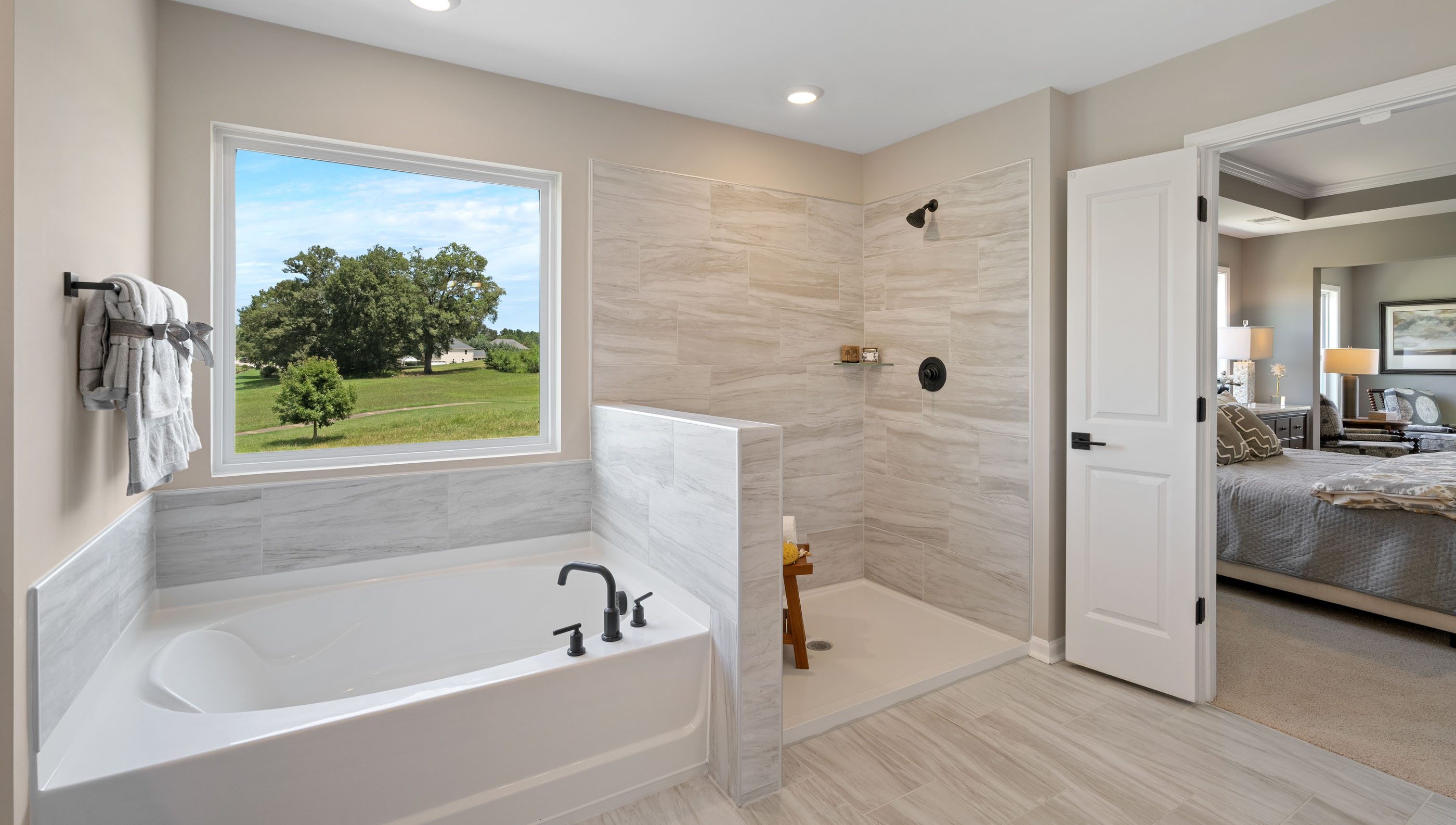 Bathroom with walk in shower and bathtub.