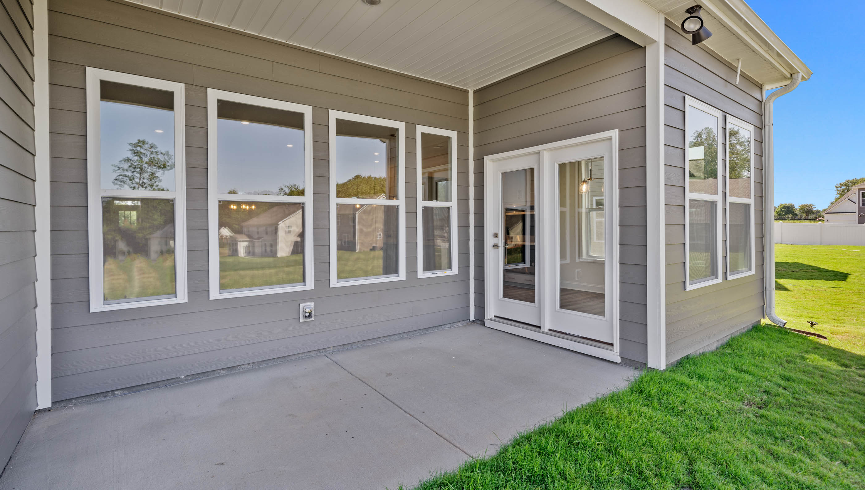 Back exterior of home with patio area.