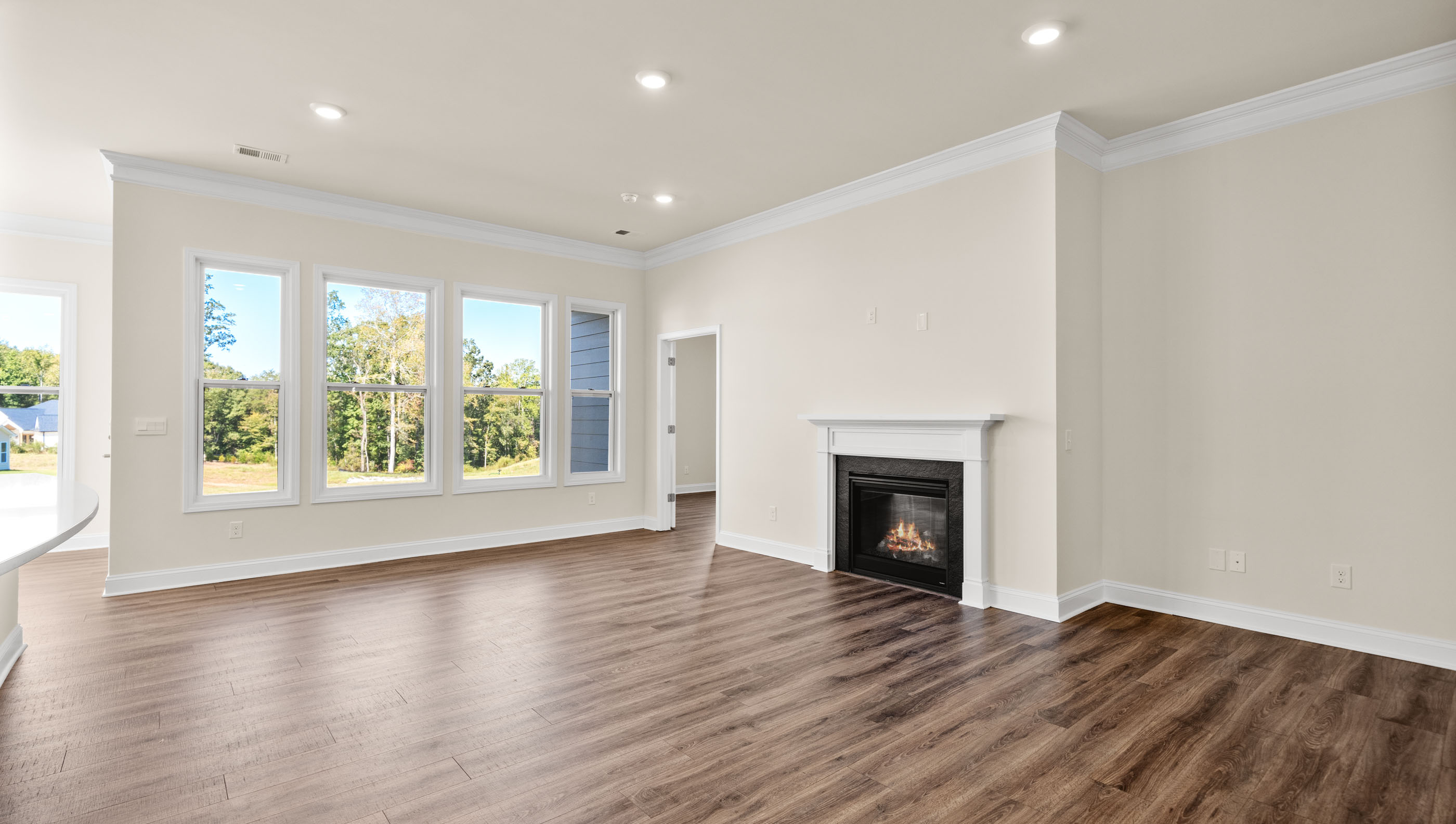 Family room with fireplace and windows.