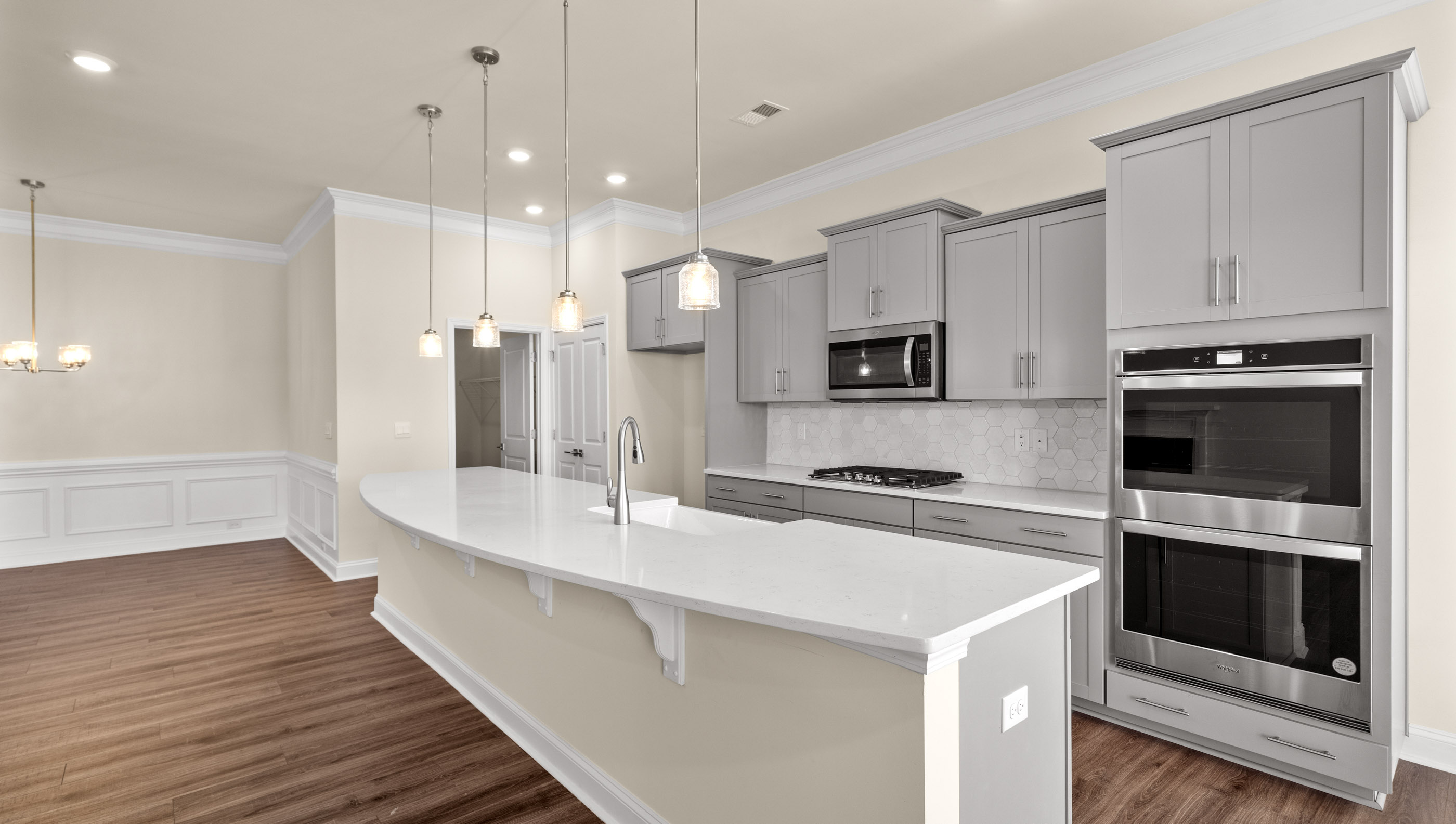 Kitchen and island with granite counter tops.