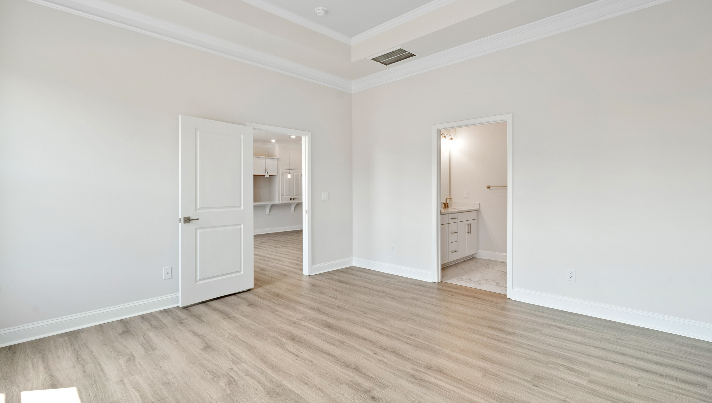 Bedroom with carpet and window.