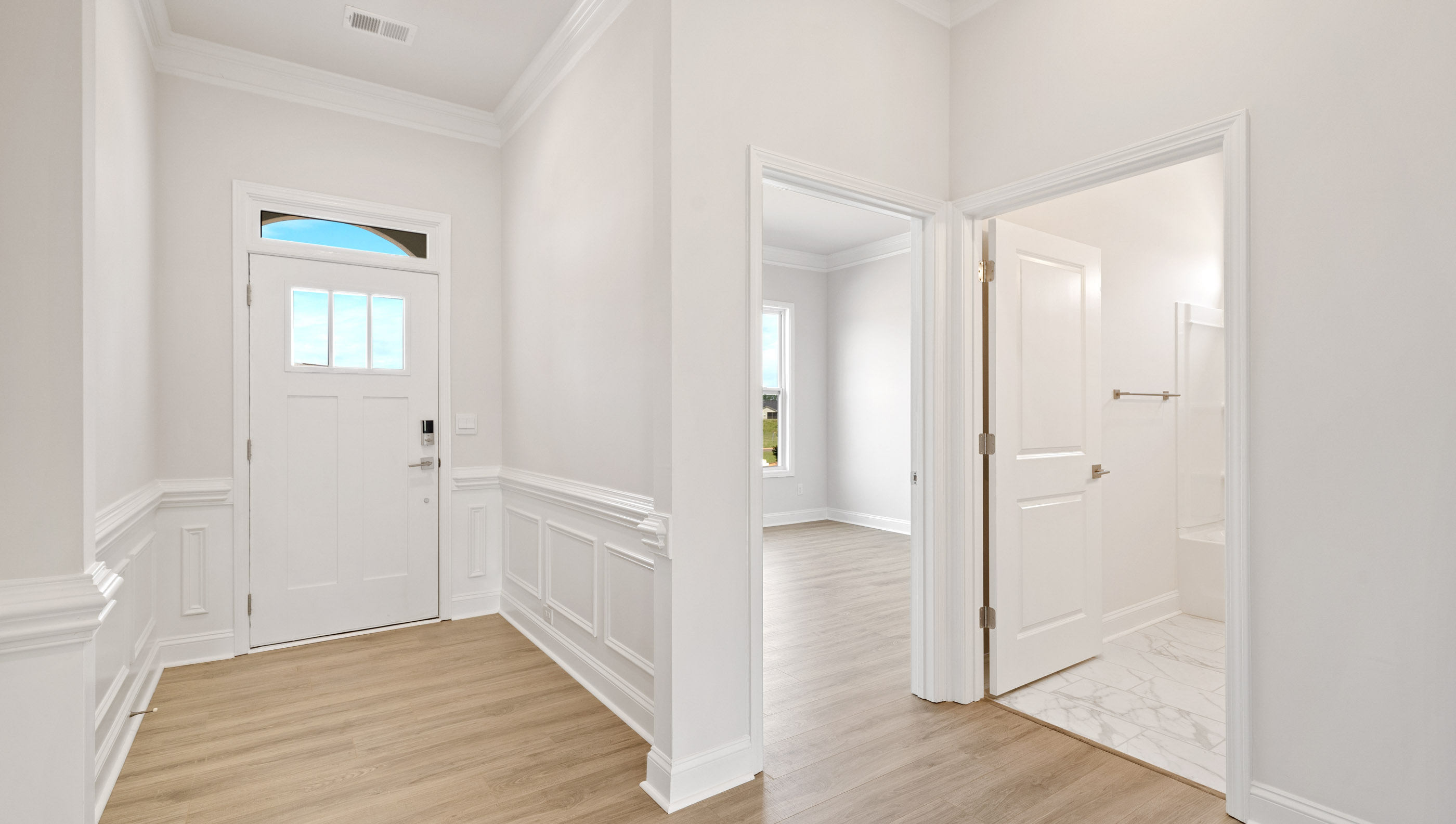 Entry way into home with view of rooms.
