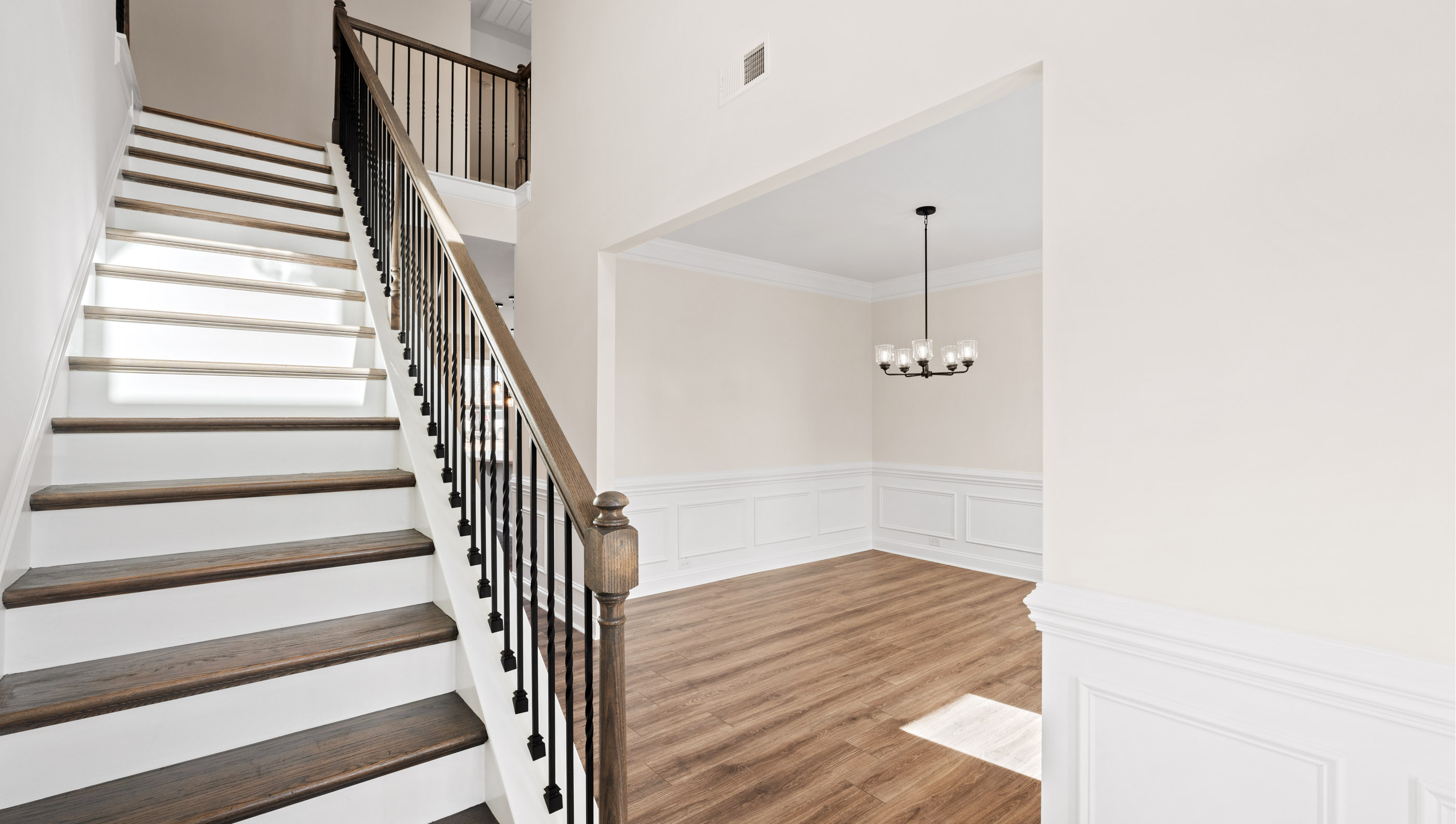 Entry way into home with view of stairs.