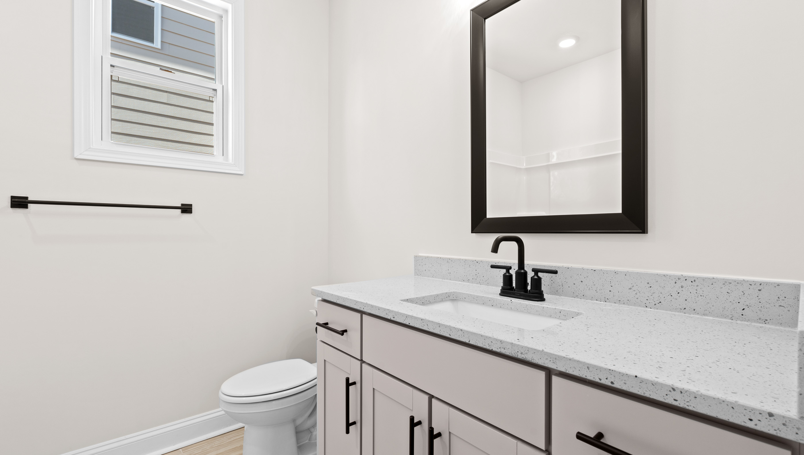 Bathroom with counter and toilet.
