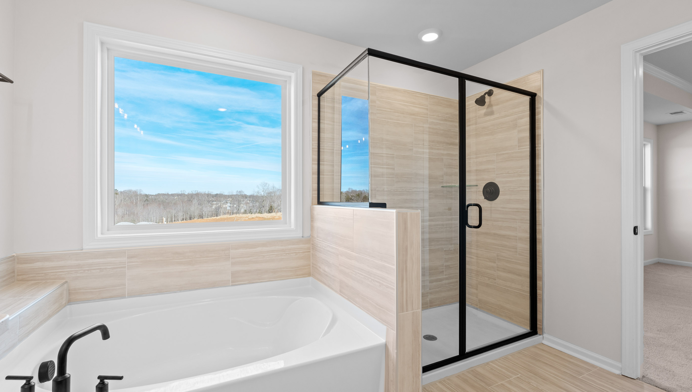 Bathroom with tub and walk in shower.