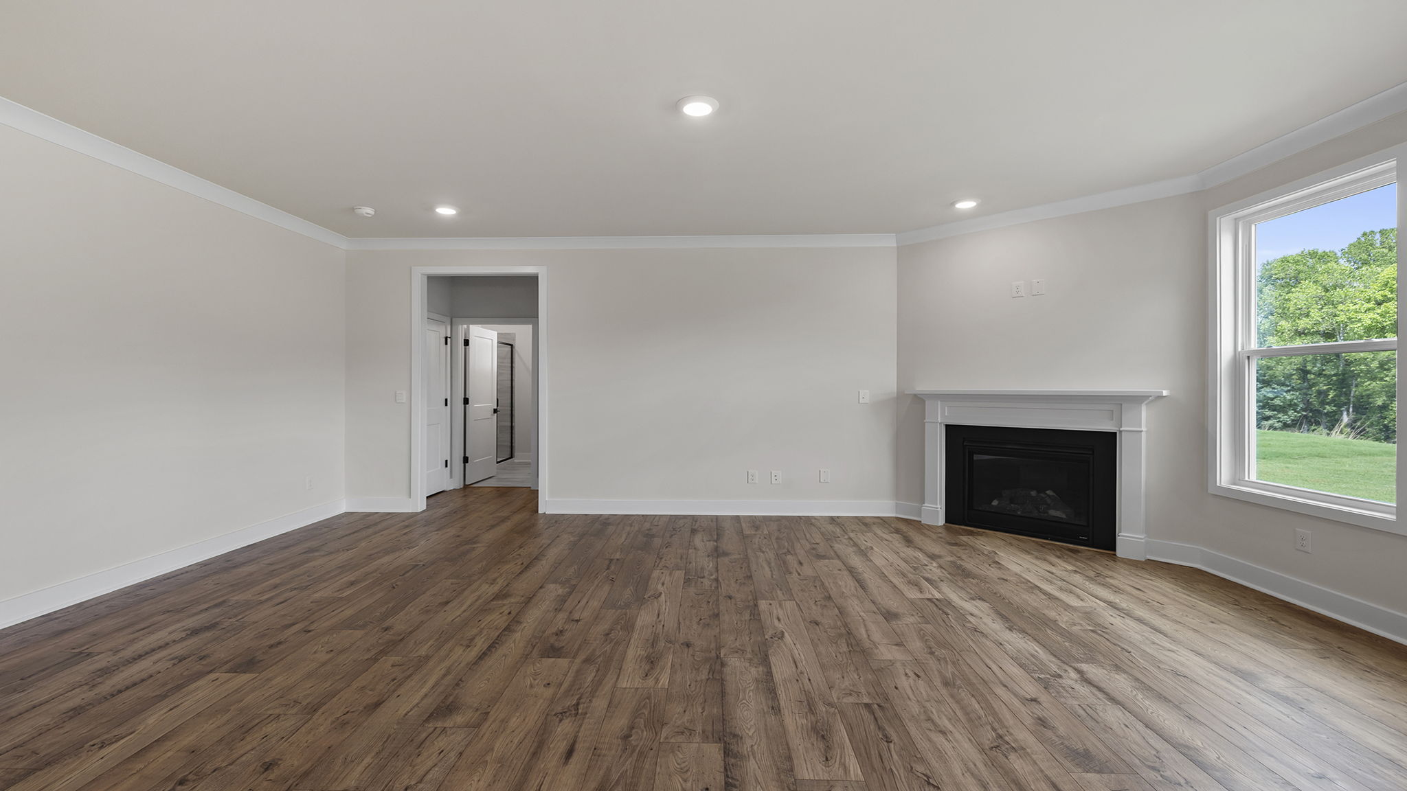 Family room with fireplace and windows.
