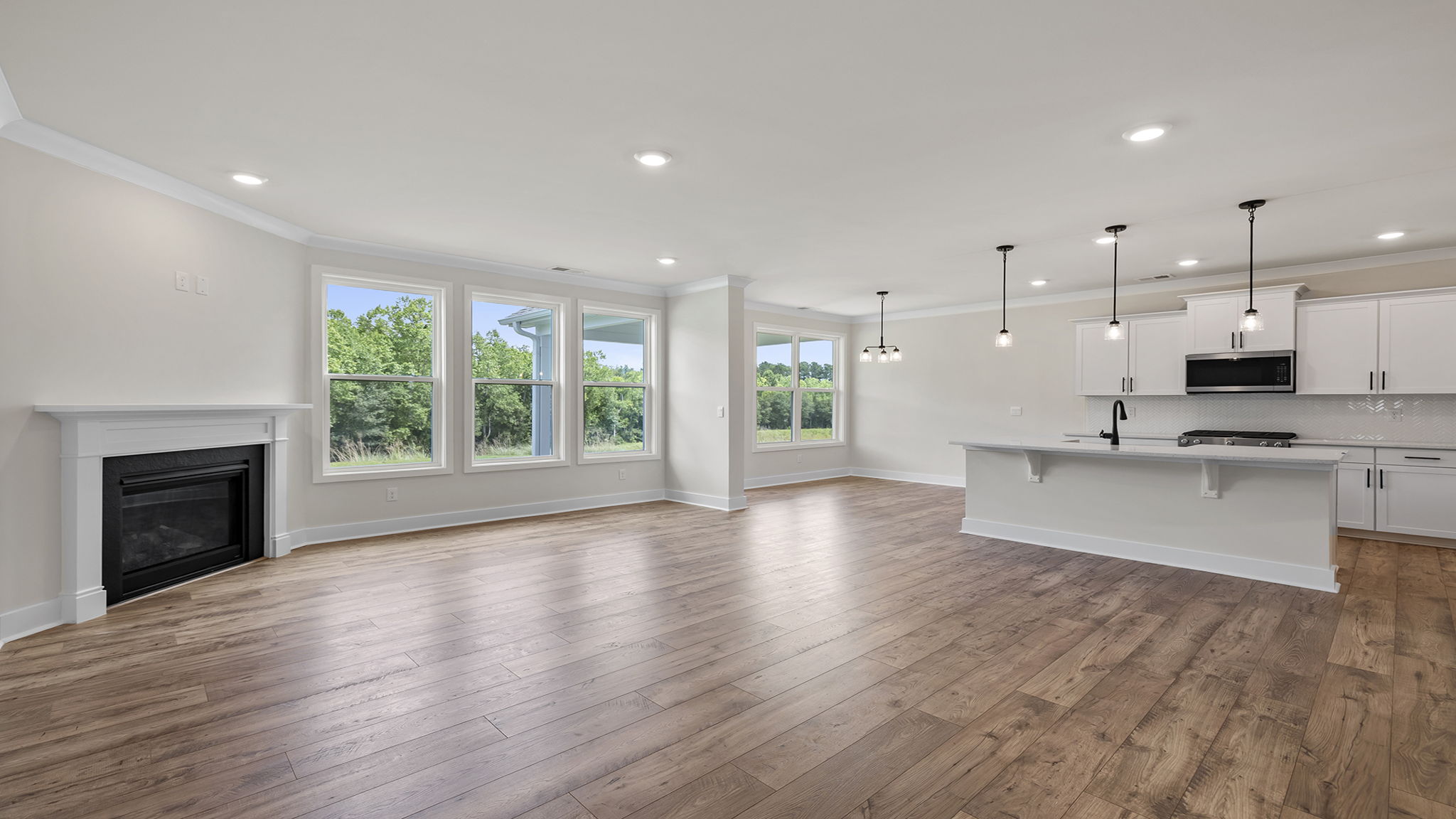 Family room with fireplace and windows.