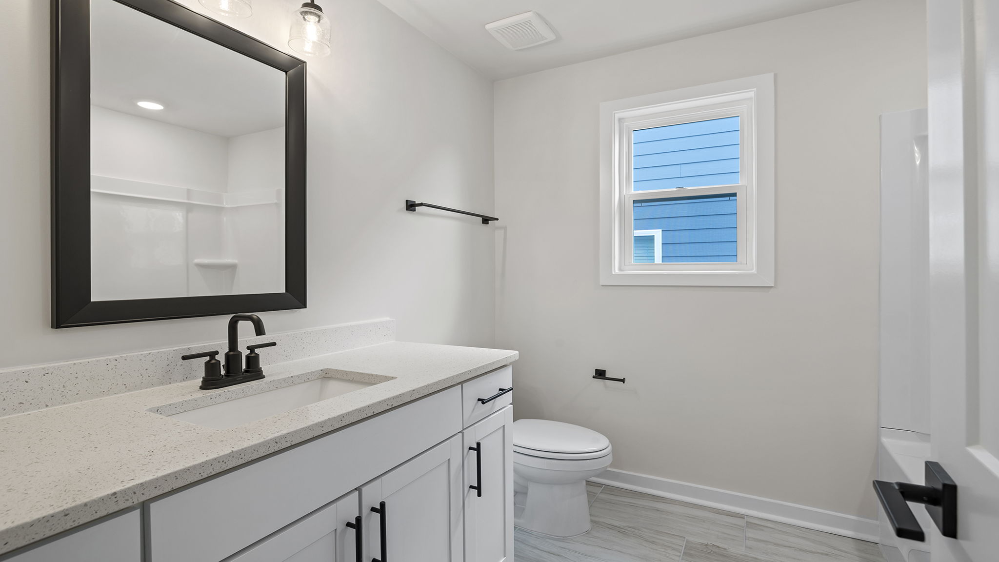 Bathroom with sink and indow.