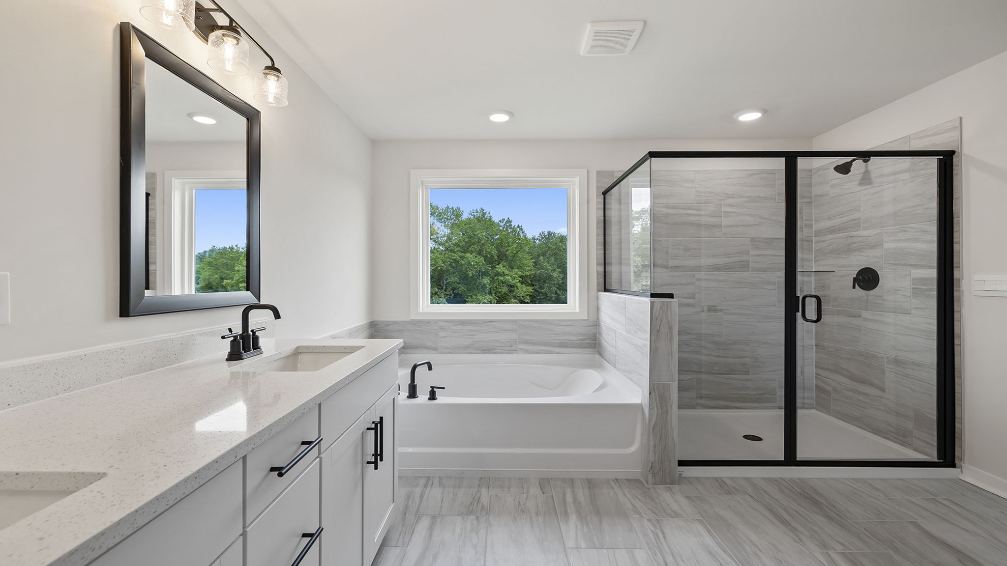 Bathroom with walk in shower and tub.