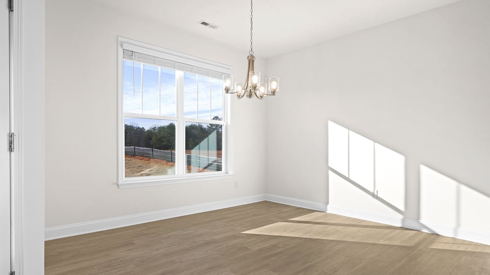 Study with windows and ceiling fan.