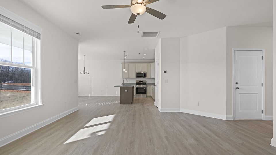 Family room with fireplace and windows.