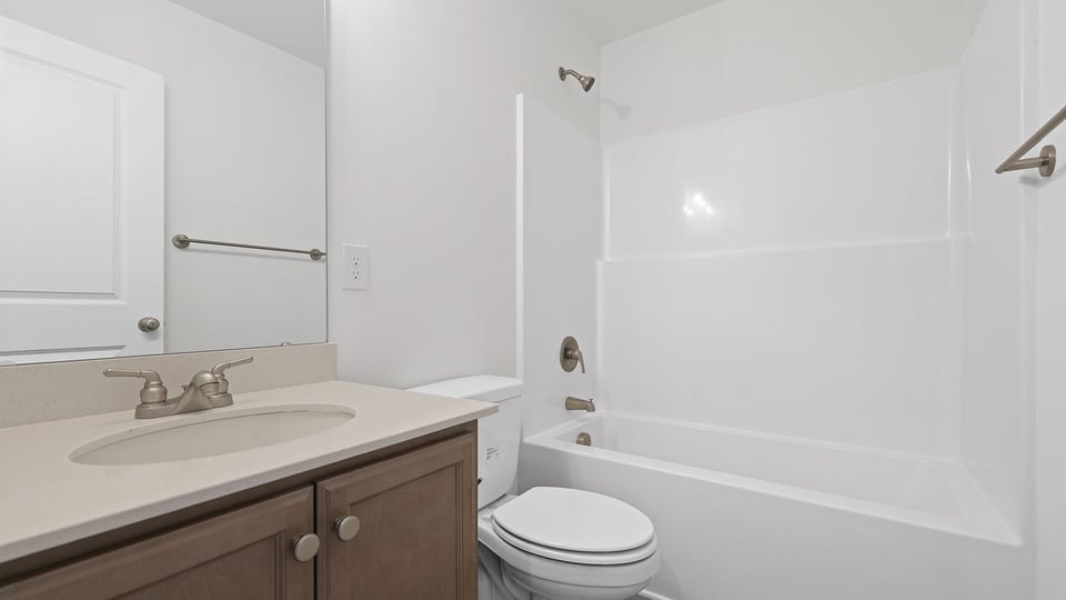 Bathroom with vanity and tub.