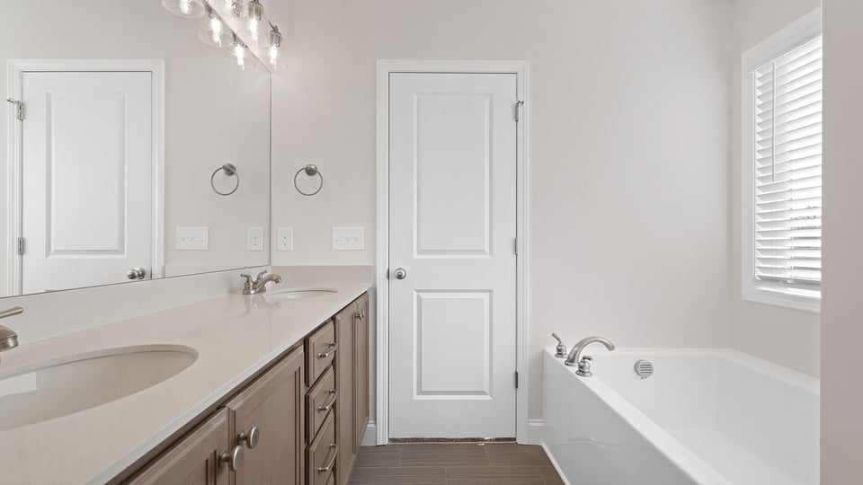 Bathroom with vanity and tub.