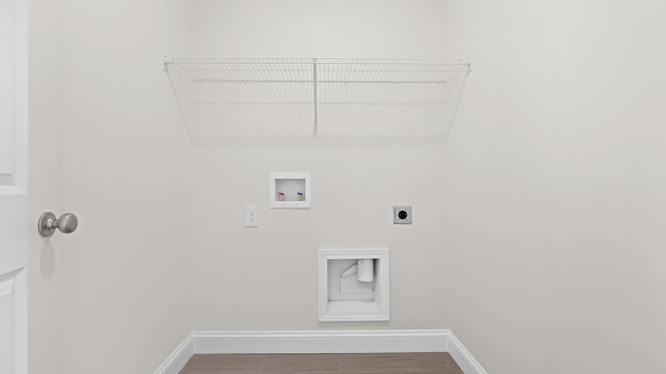 Walk in laundry with shelves.