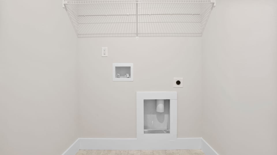 Laundry room with hanging storage racks.