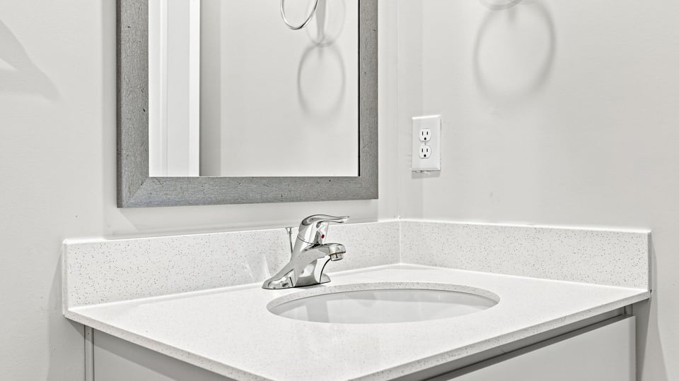 Bathroom with single vanity sink.