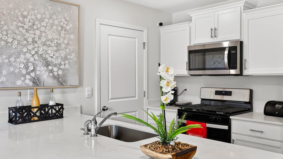 Kitchen with quartz countertops.