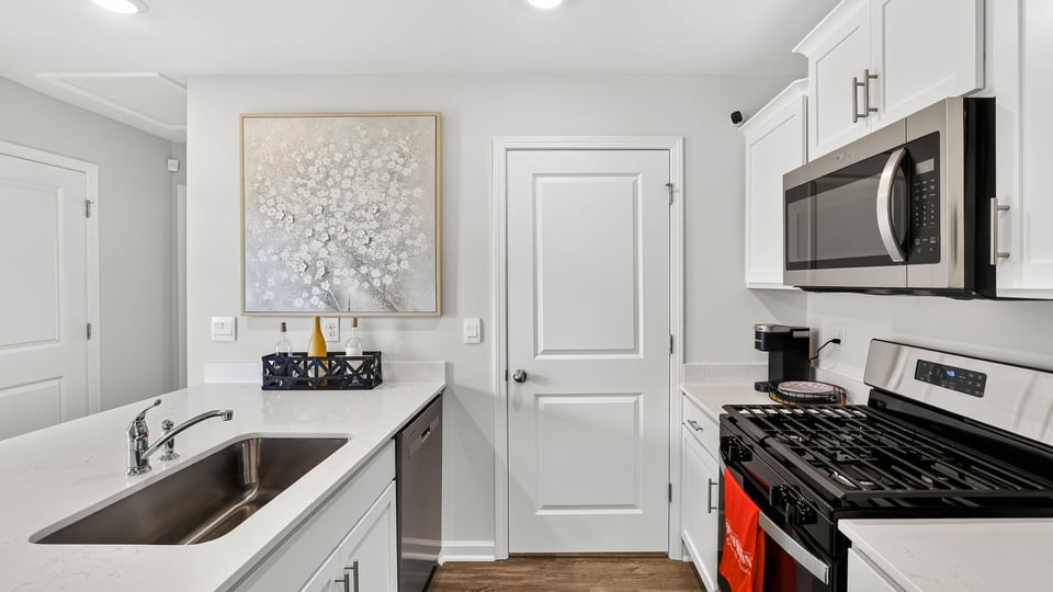 Kitchen with quartz countertops.