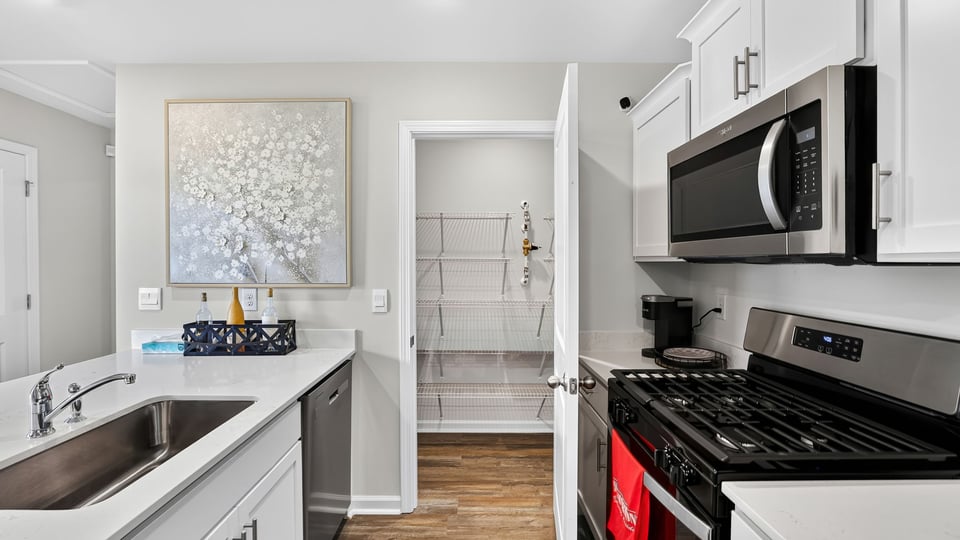 Kitchen with quartz countertops.