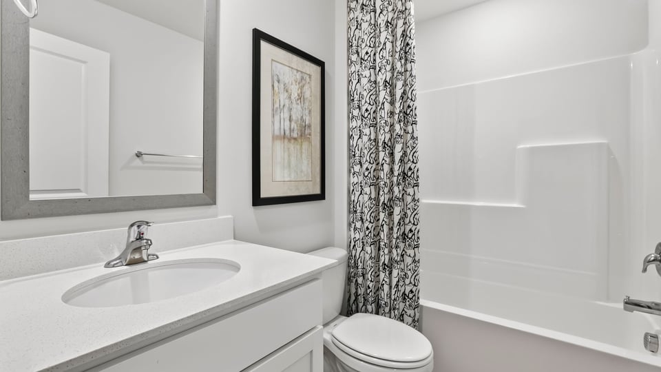 Bathroom with vanity and tub.