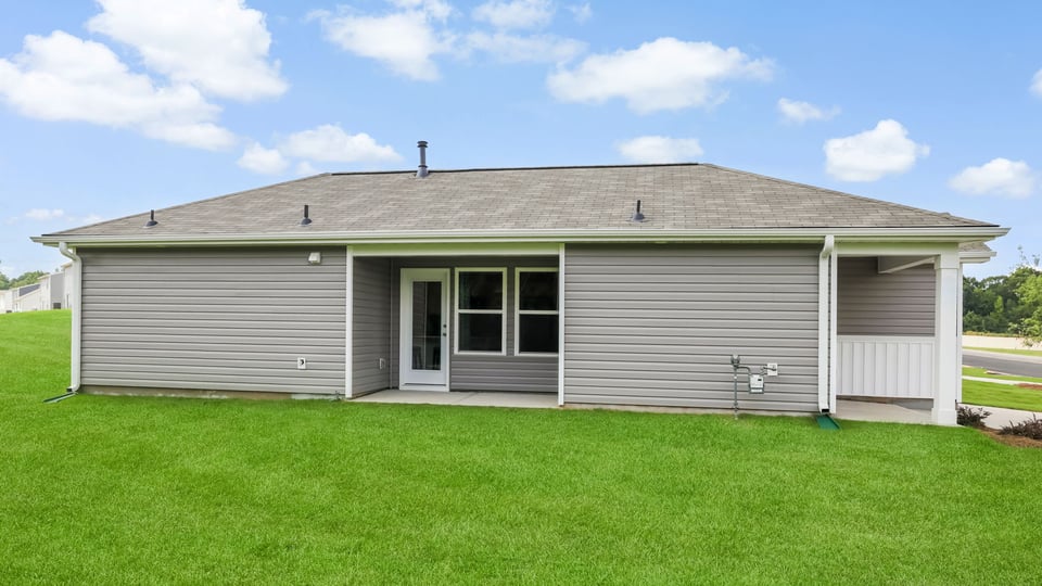 Side of home with covered porch.