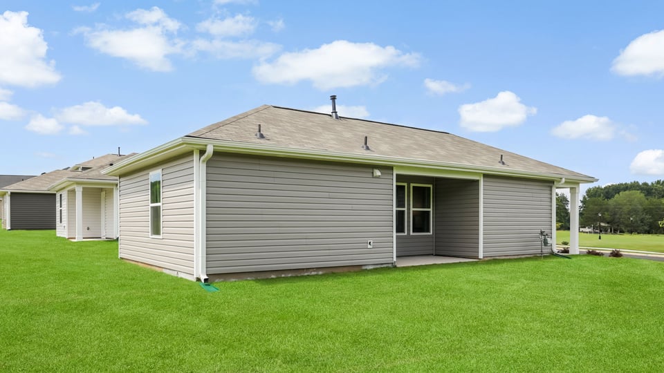 Side of home with covered porch.