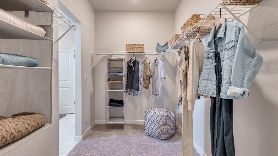 Landau Heights walk in closet with connection to the laundry room