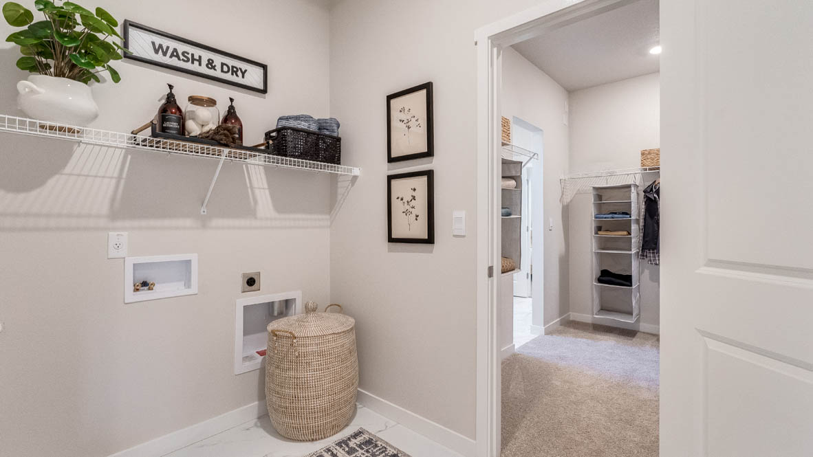 Landau Heights laundry room that connects to the walk in closet