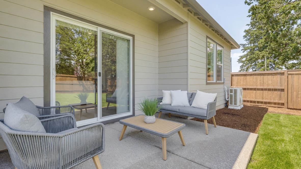 Landau Heights Backyard with grass and paved area with outdoor furniture