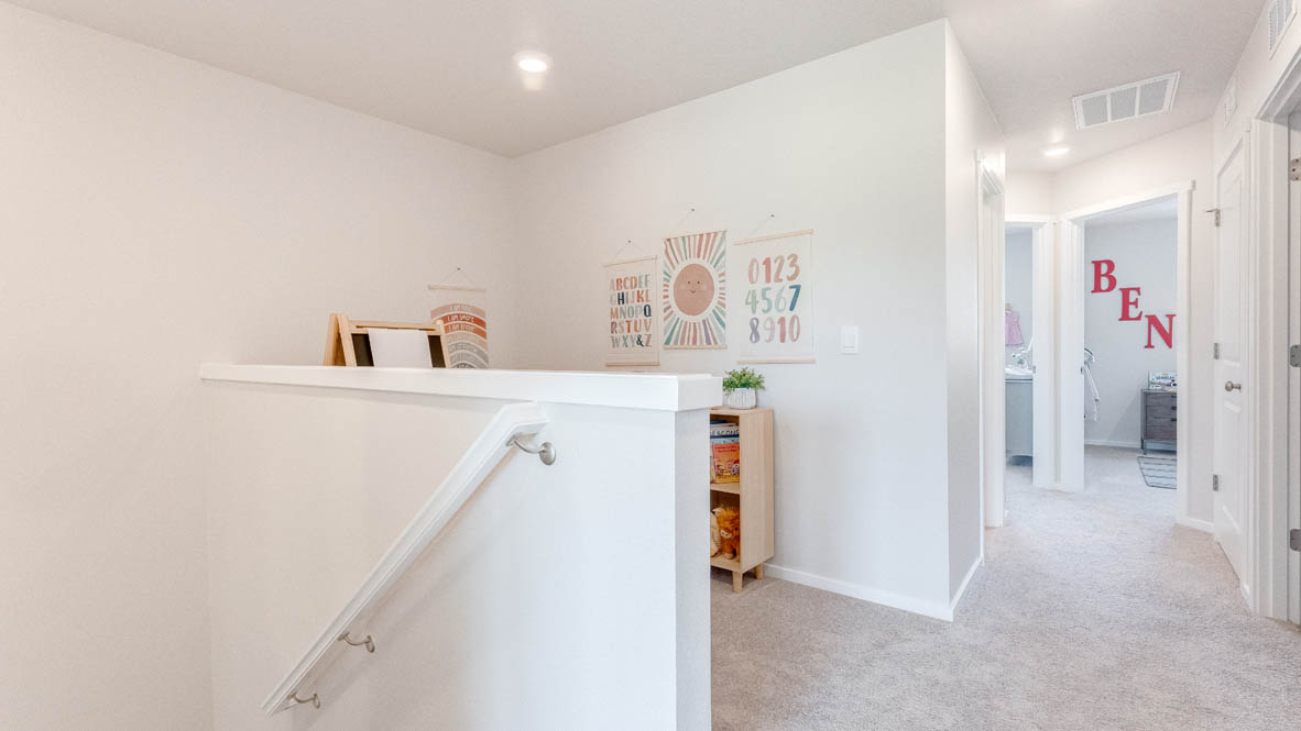 Terrace at Pleasant Valley Hallway with the staircase, carpet, and white walls