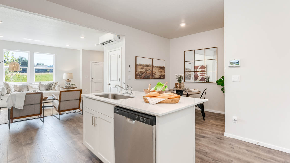 Terrace at Pleasant Valley Kitchen with an island, shaker style cabinets, solid surface countertops, and stainless steel appliances
