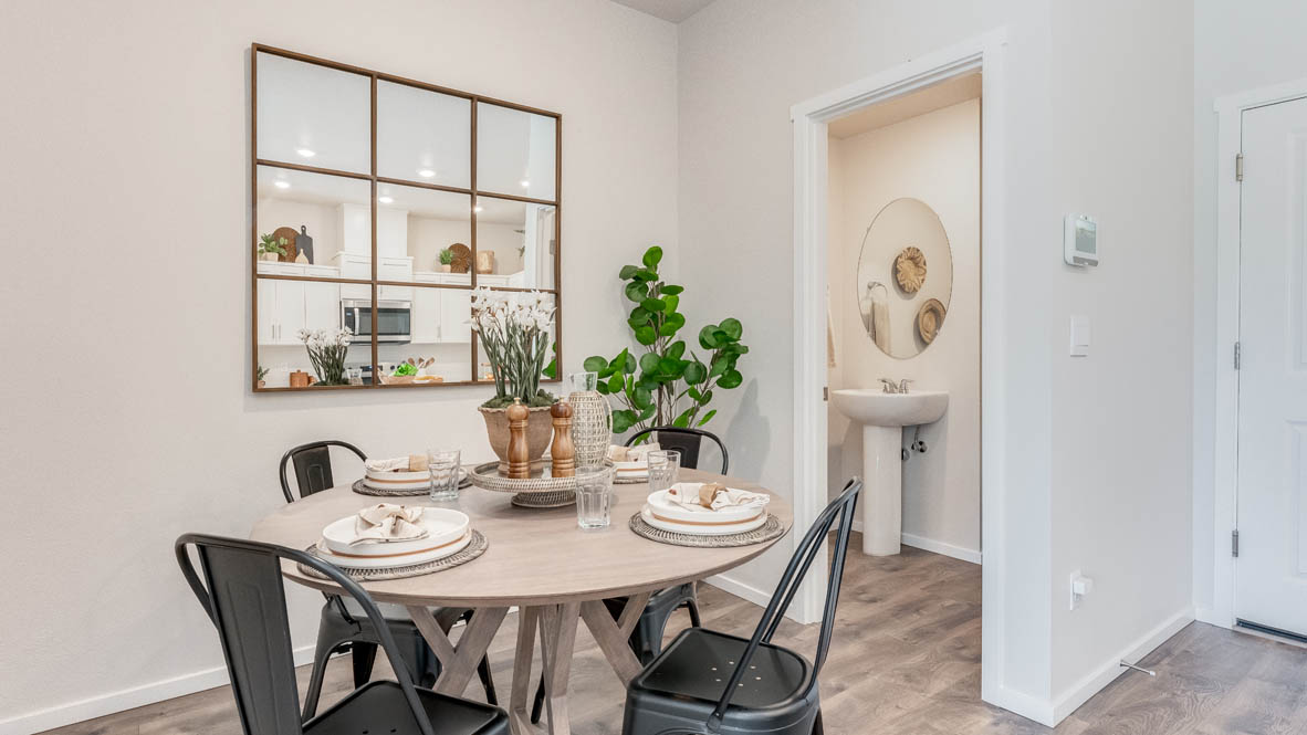 Terrace at Pleasant Valley Dining and Great room with a table with chairs, powder room in the background