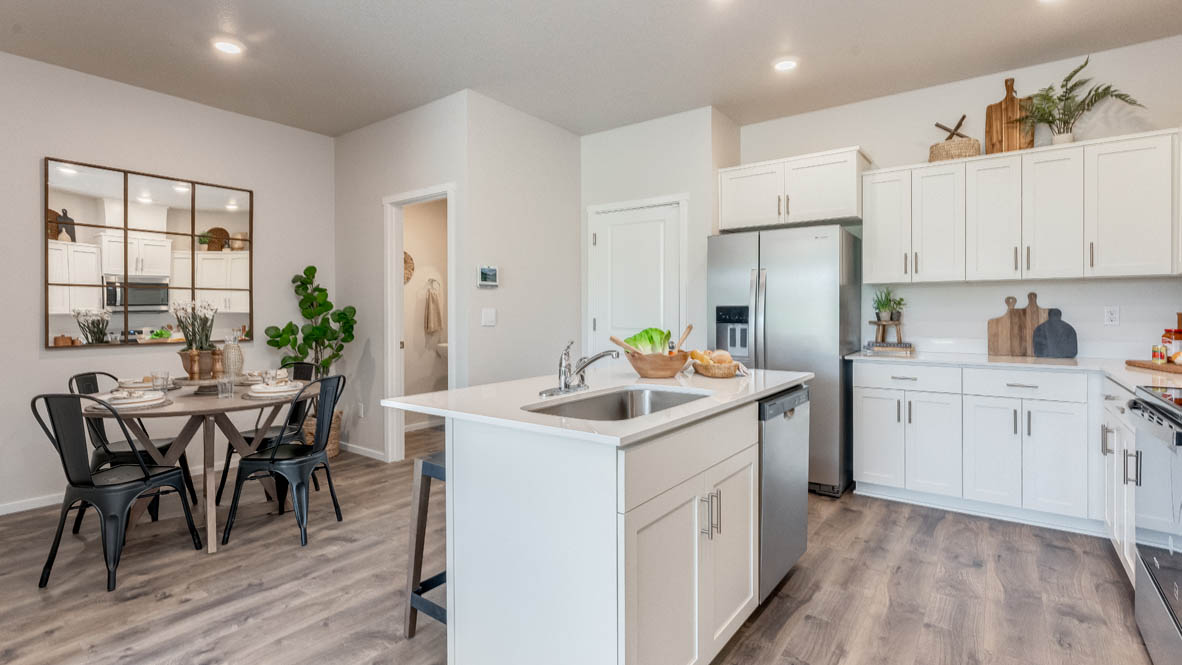 Terrace at Pleasant Valley Kitchen with an island, shaker style cabinets, solid surface countertops, stainless steel appliances
