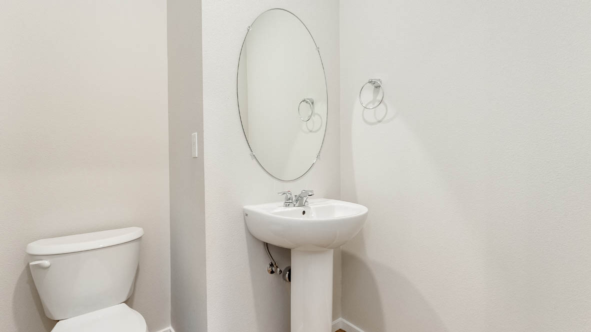 Terrace at Pleasant Valley Powder Room with single sink vanity, oval mirror, toilet