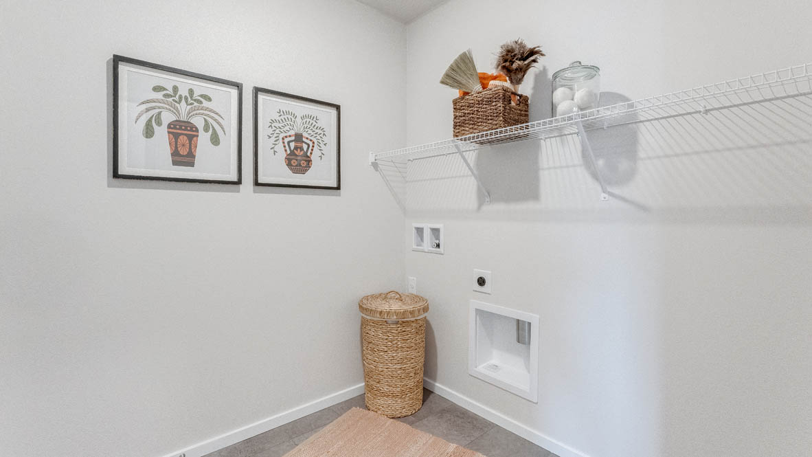 Terrace at Pleasant Valley Laundry room with white walls, decorations, and white wire shelving