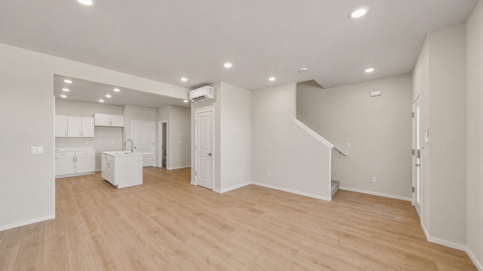 Great room with laminate flooring and an electric fireplace
