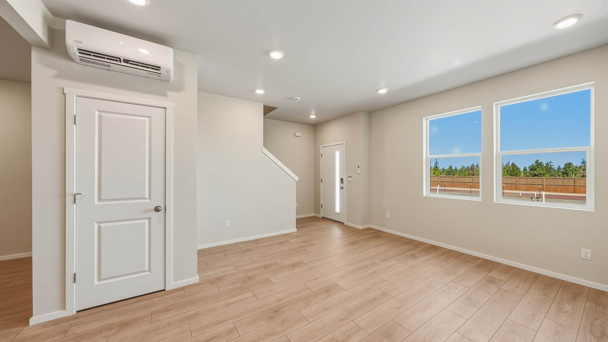Great room with laminate flooring and an electric fireplace