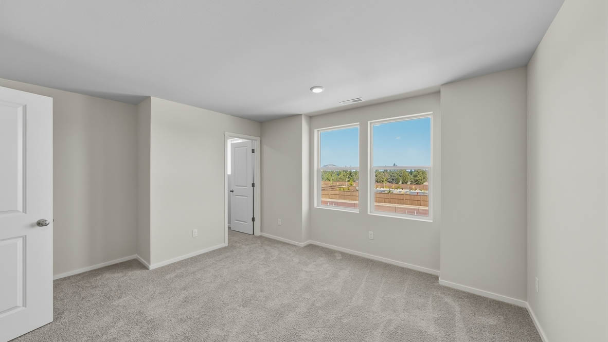 Primary bedroom with wall-to-wall carpet, a walk-in closet and an attached bathroomPrimary bedroom with wall-to-wall carpet, a walk-in closet and an attached bathroom