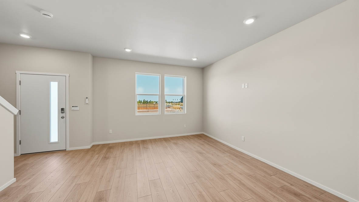 Great room with laminate flooring and an electric fireplace