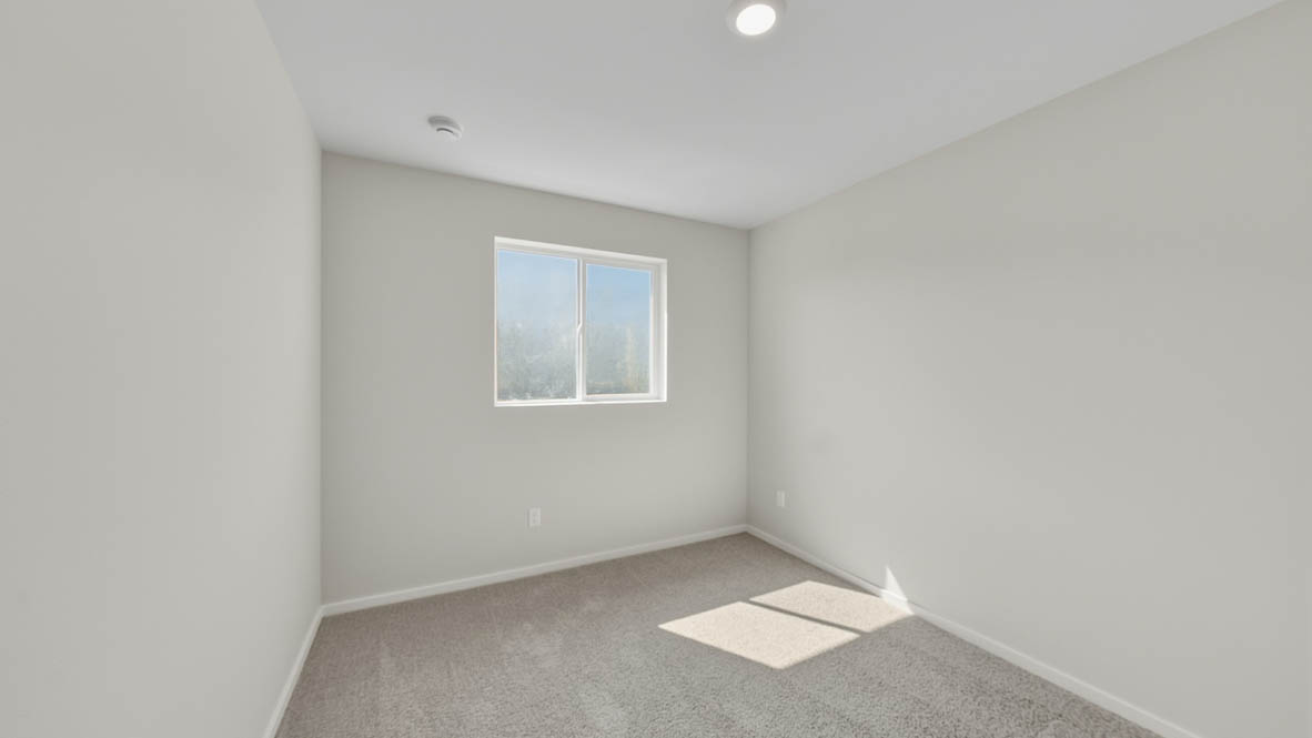 Bedroom with wall-to-wall carpet and a closet