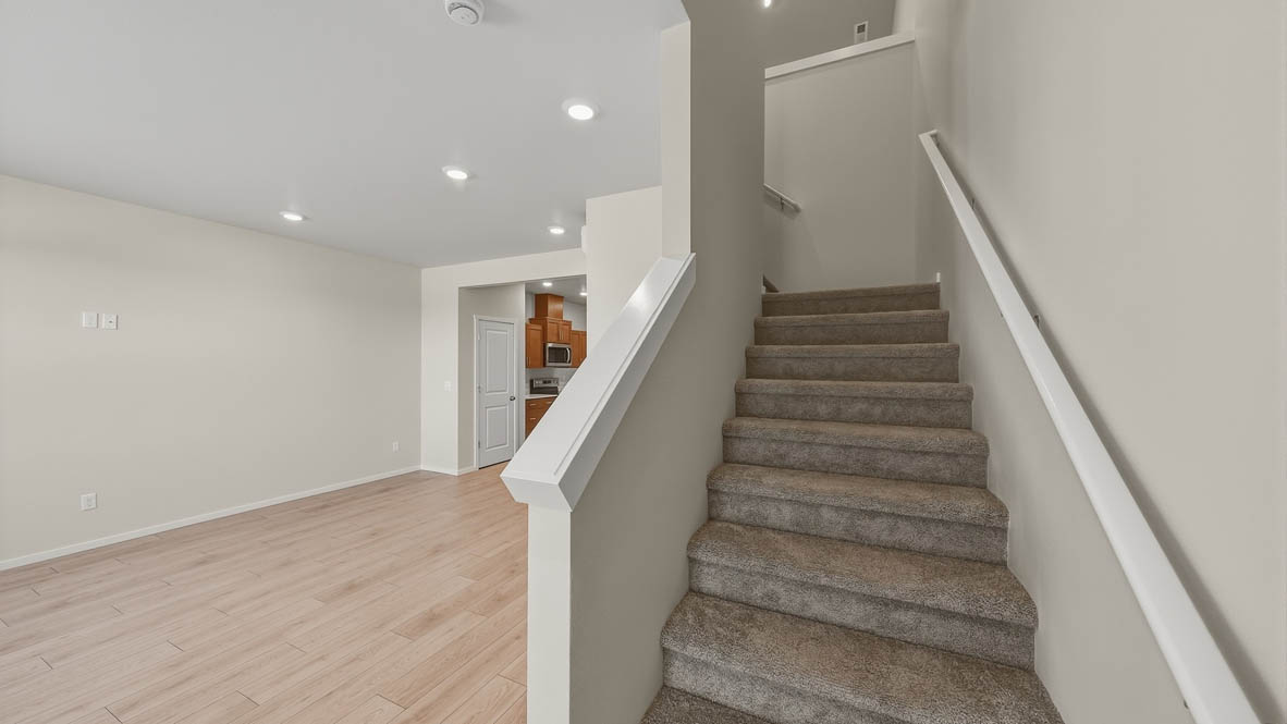 Entryway with a coat closet and laminate flooring