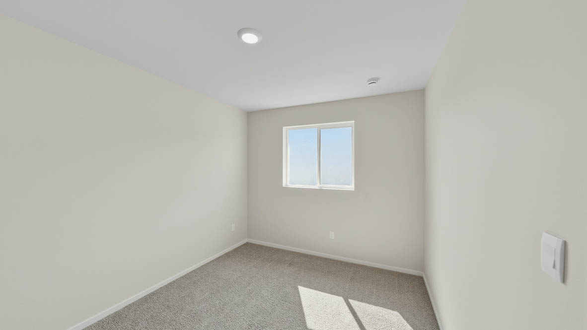 Bedroom with wall-to-wall carpet and a closet