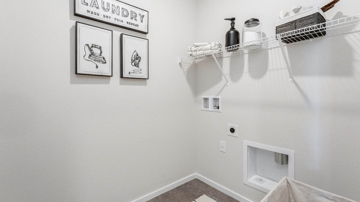 Terrace at Pleasant Valley Laundry room with white walls, decorations, and white wire shelving