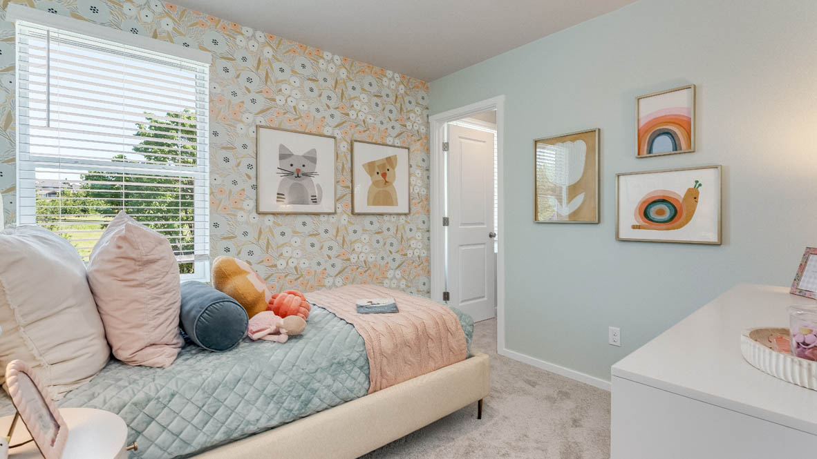 Terrace at Pleasant Valley bedroom with a bed and pink bedding, a white dresser with a mirror, two decorations, carpet, and a window