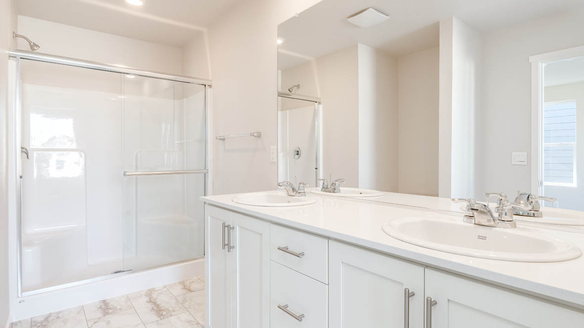 Terrace at Pleasant Valley bathroom with solid surface countertops, toilet, and walk in shower